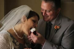 Couple eating wedding cake